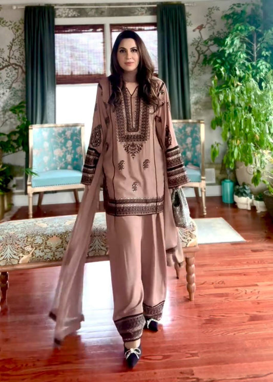 Timeless Sophistication: A Woman in Brown Amidst Luxury Living