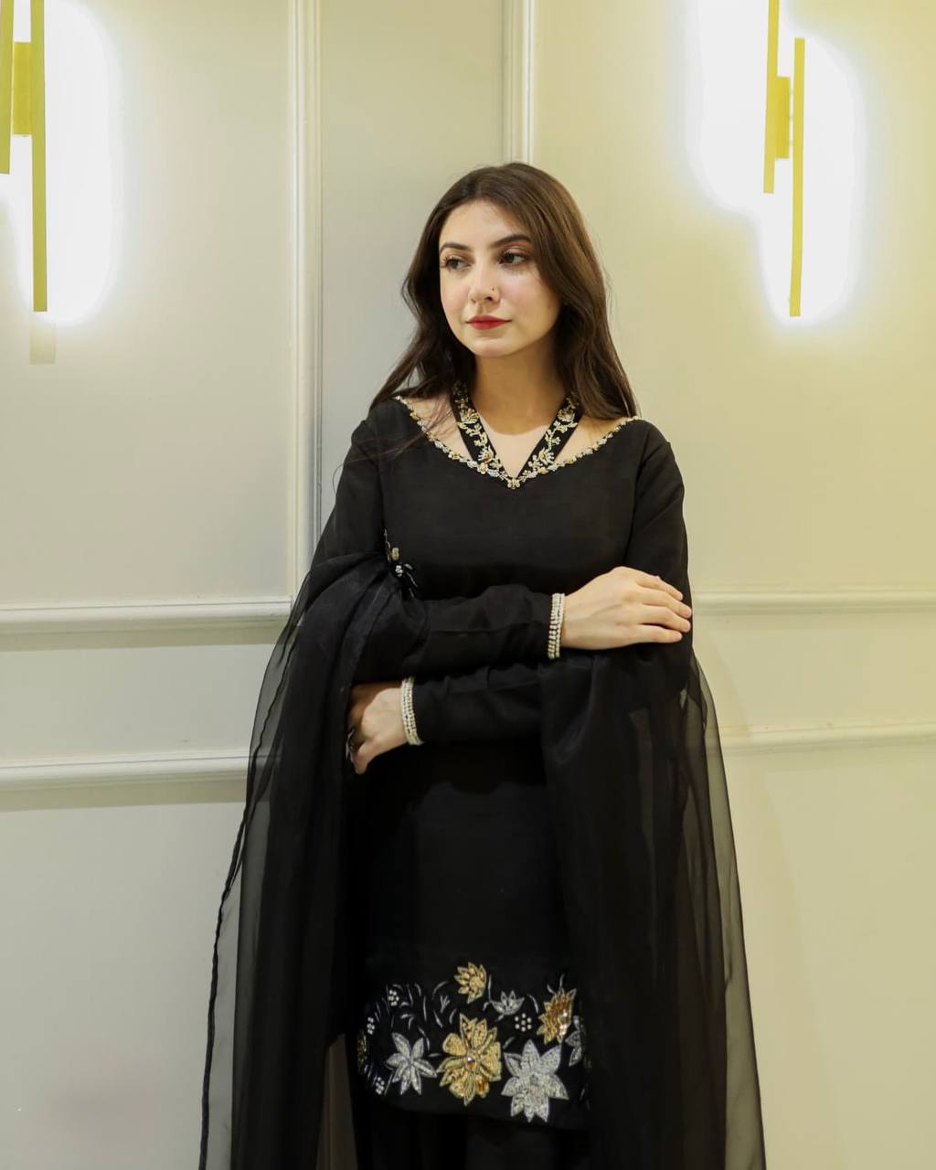 Elegance in Black: A Captivating Pose of Timeless Beauty