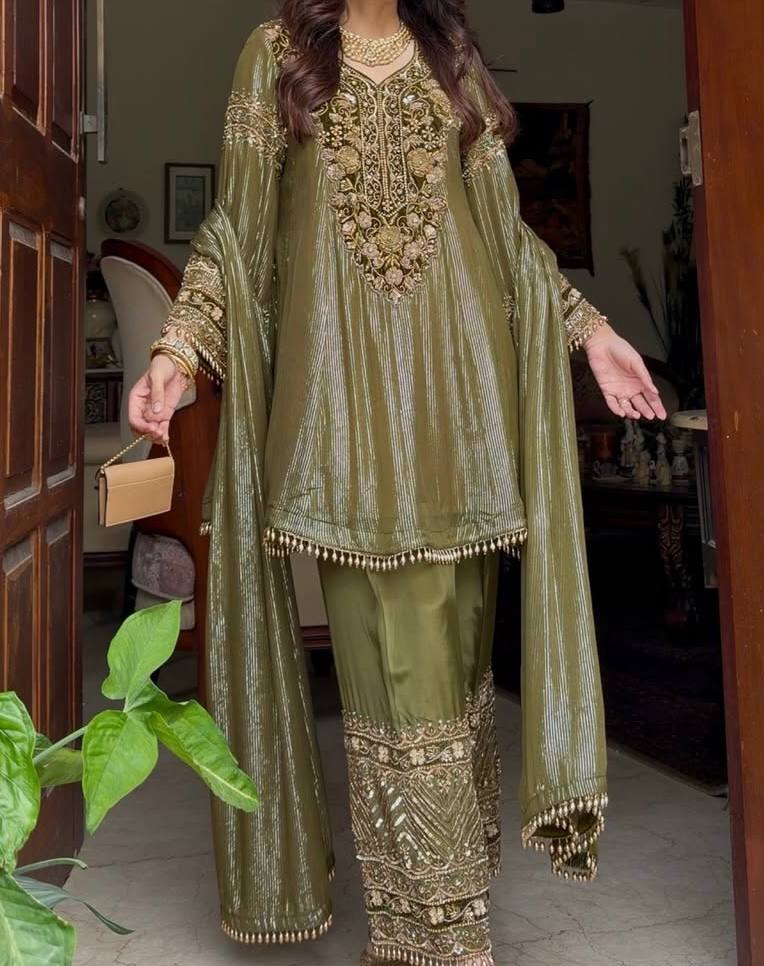 An opulent olive green ensemble that radiates timeless elegance